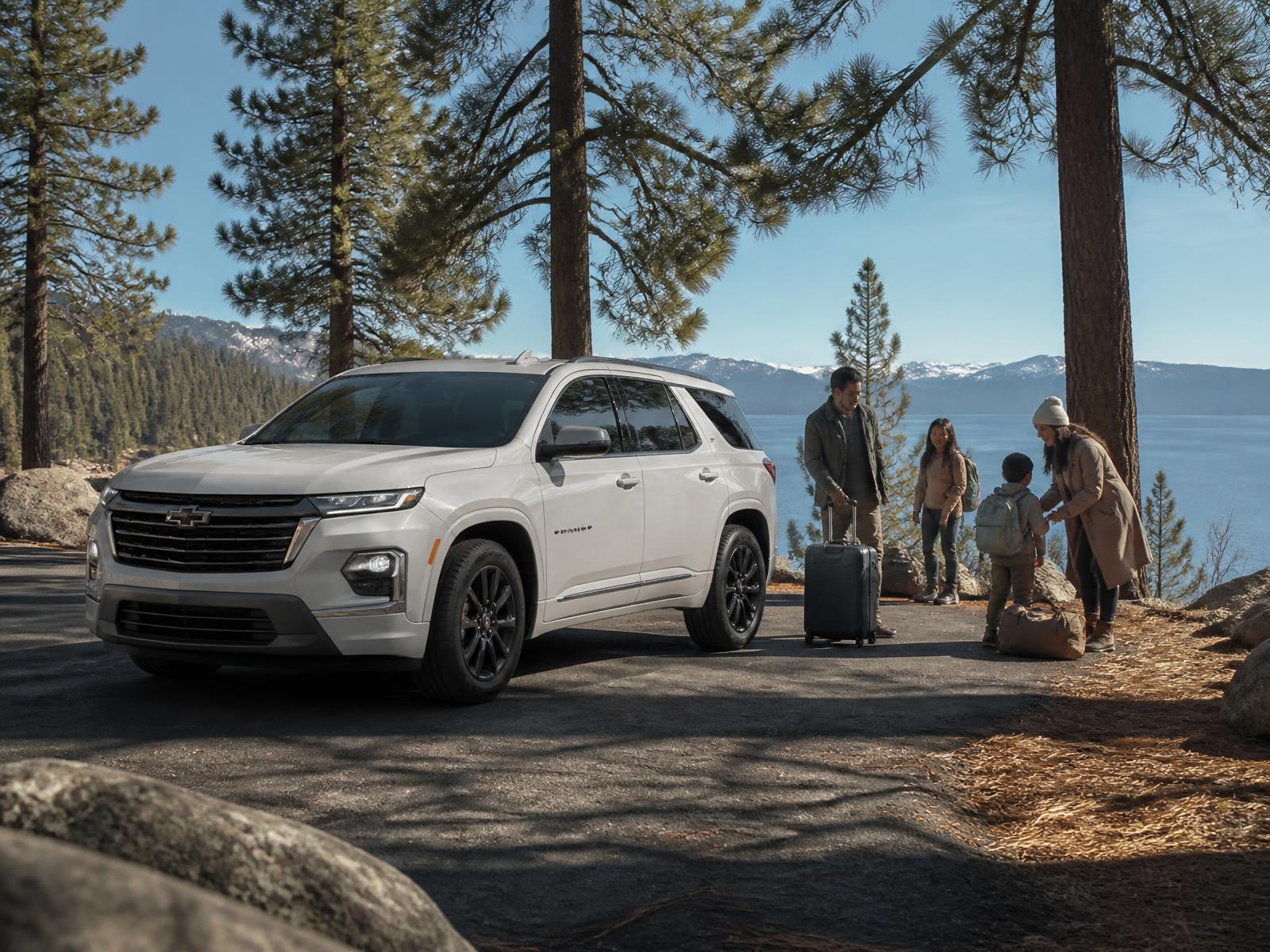 White Chevrolet Traverse with a family at Lake Tahoe